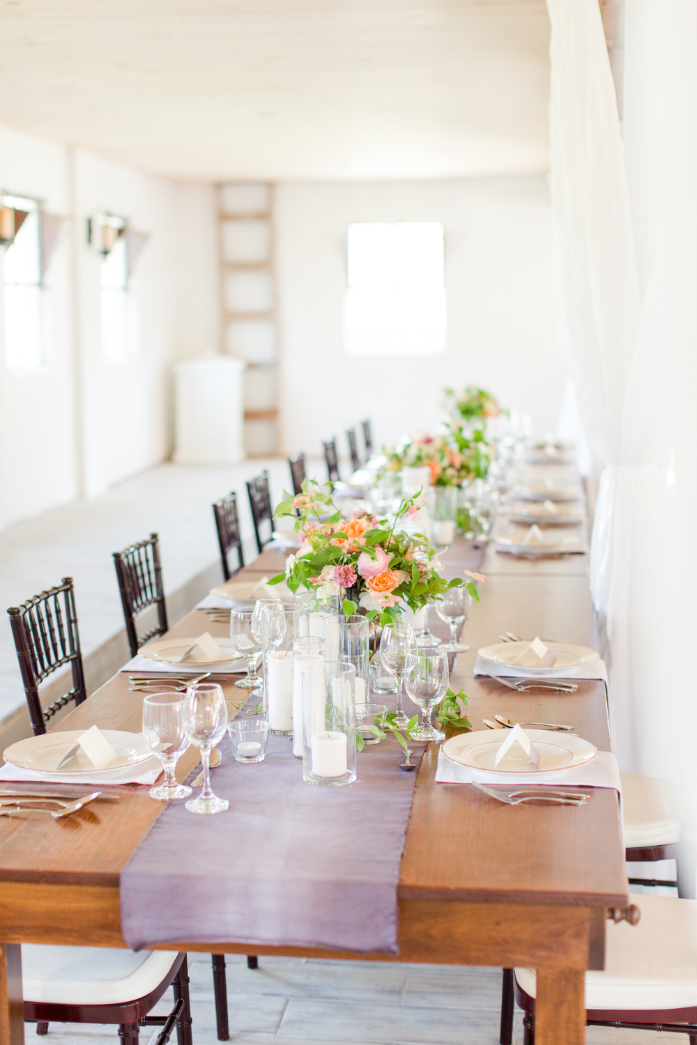 Genevieve used cylinder vases and candles to create an enchanting setting