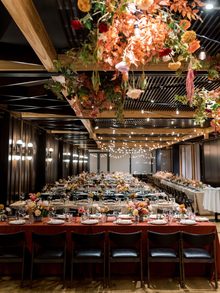 a fall wedding in DC by The One Moment Events. A moody tablescape with textured and patterned linens and fall flowers at District Winery