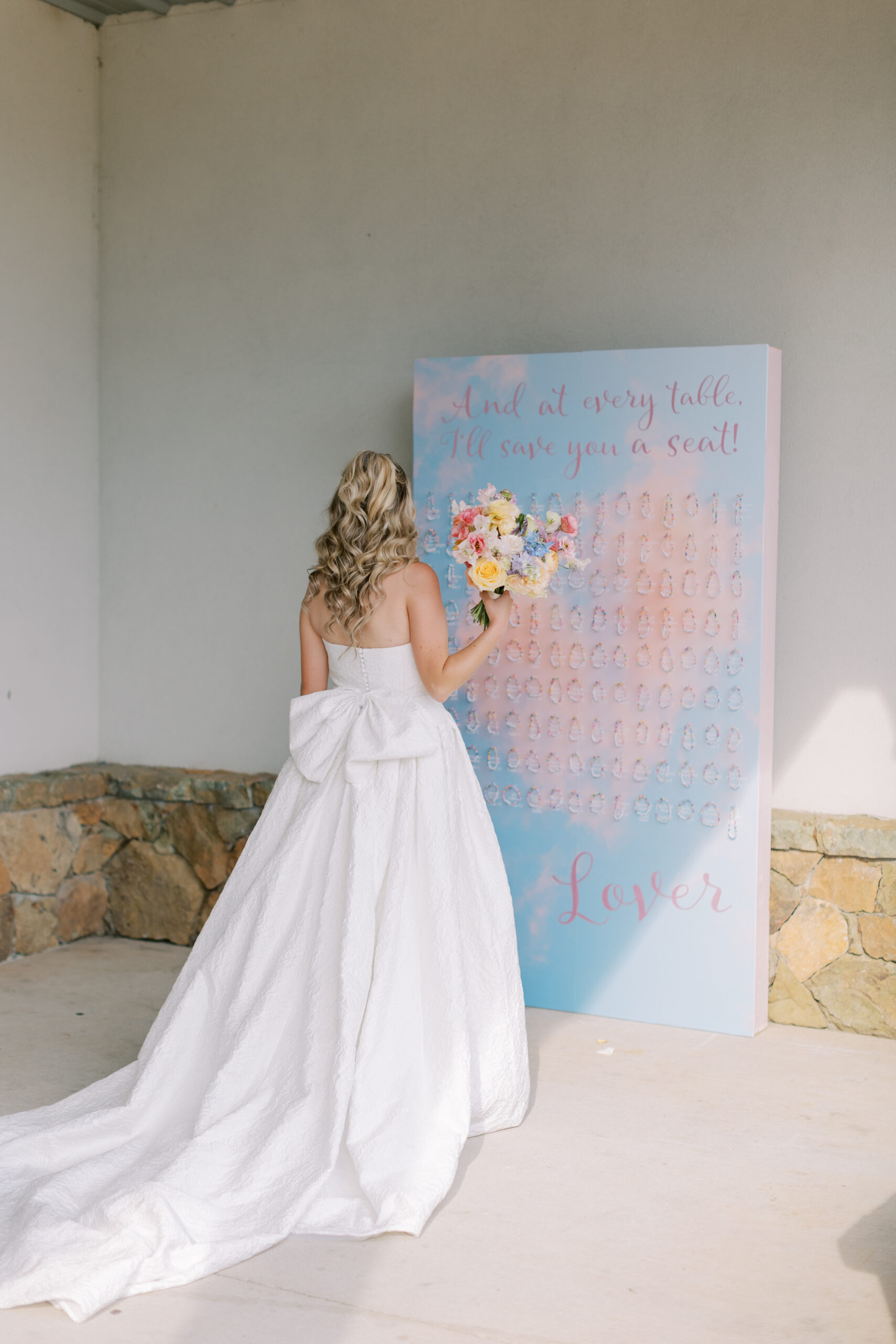 Taylor Swift Lover album inspired wedding escort card wall with friendship bracelets