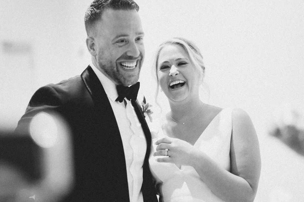 Destination wedding couple posing at the Gibbes Museum of Art in Charleston, SC. Luxury wedding design by The One Moment Events featuring classic Lowcountry style and modern editorial flair.