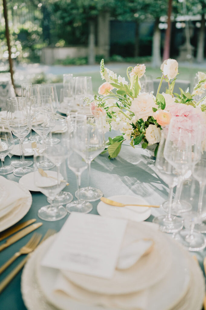 Organic and modern Lowcountry wedding table decor with rattan textures, sage green accents, and custom stationery at the Gibbes Museum in Charleston, SC.