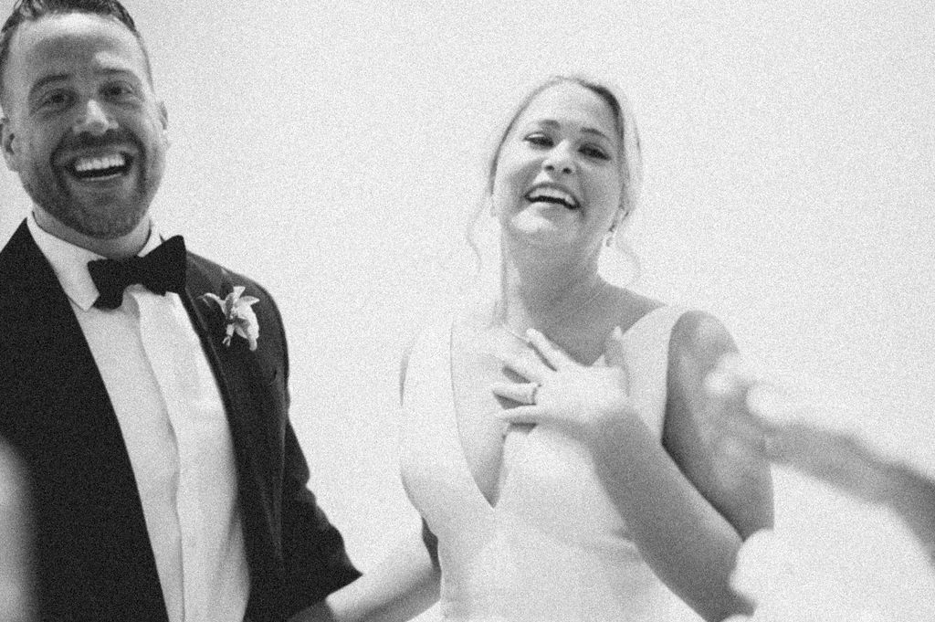 Destination wedding couple posing at the Gibbes Museum of Art in Charleston, SC. Luxury wedding design by The One Moment Events featuring classic Lowcountry style and modern editorial flair.